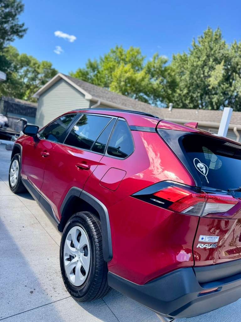 Red SUV with a polished exterior finish